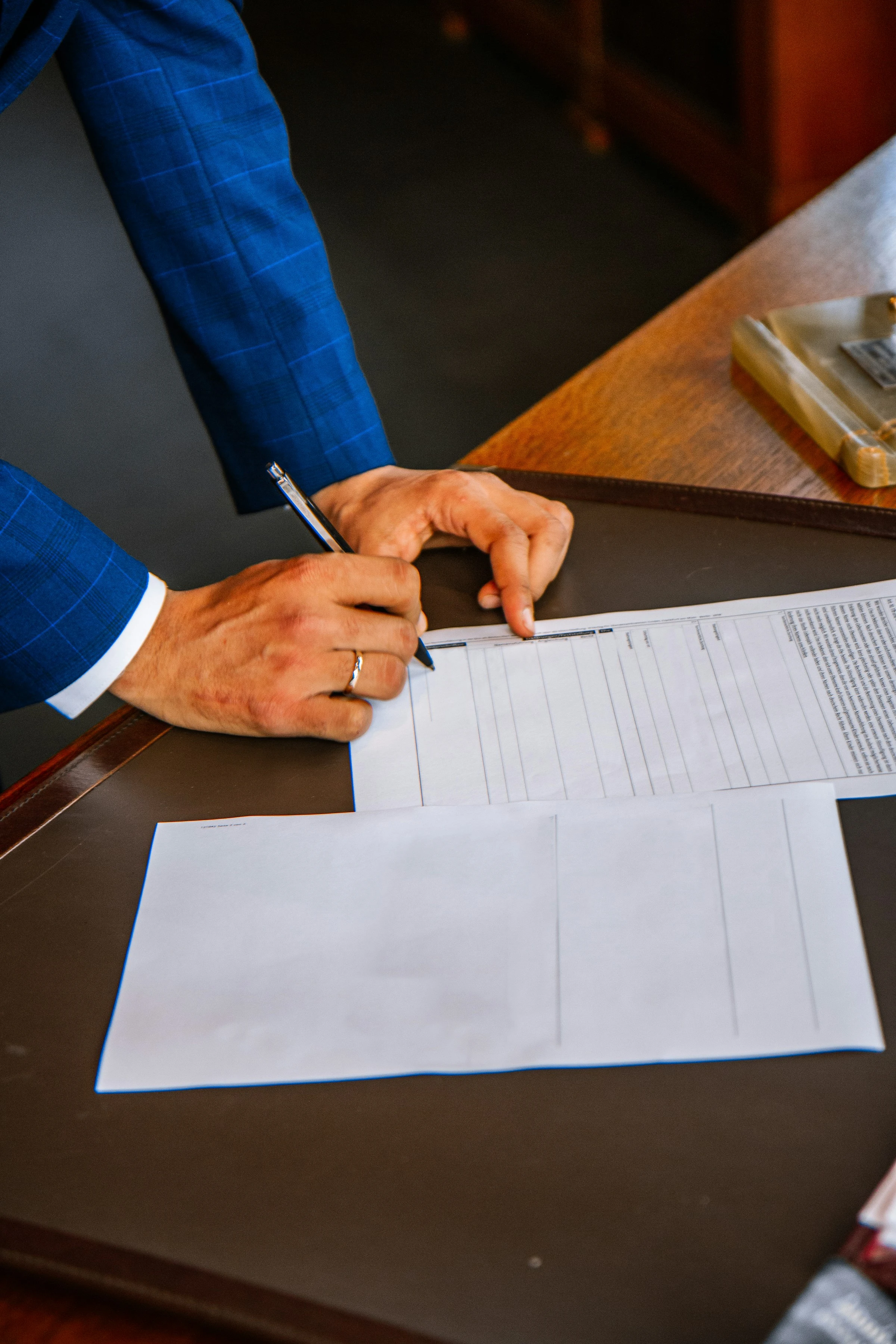 Attorney reviewing legal documents for breach of contract litigation case preparation.