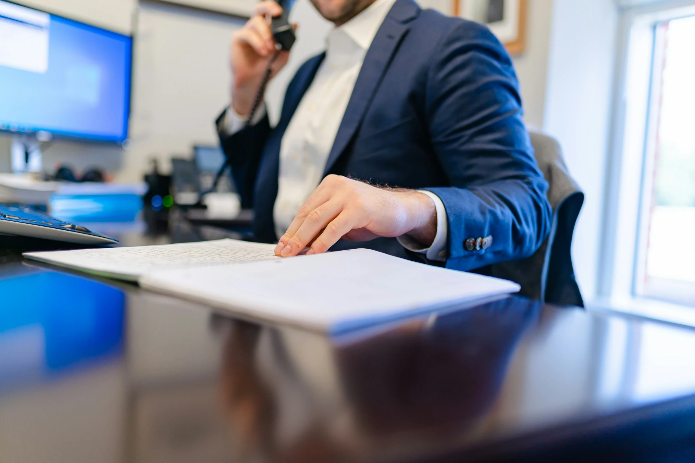 Employment and non-compete attorney analyzing restrictive covenants during client consultation.